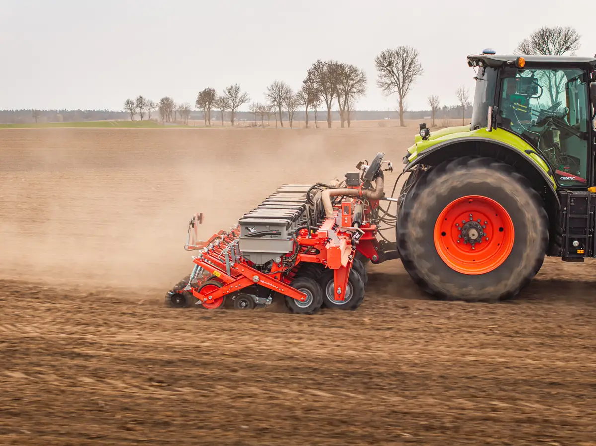 Czajkowski PSP precision seeder pulled by a tractor while working in the field.